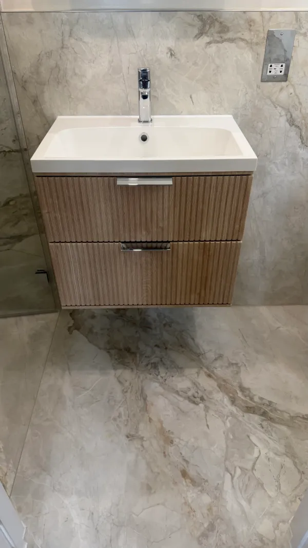 Ribbed timber vanity with a rectangular white basin